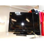 A Toshiba 22" LCD cololur television, model no 32BV500B, with remote.
