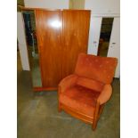 An Ercol style elm framed armchair upholstered in patterned red fabric, together with an Austinsuite