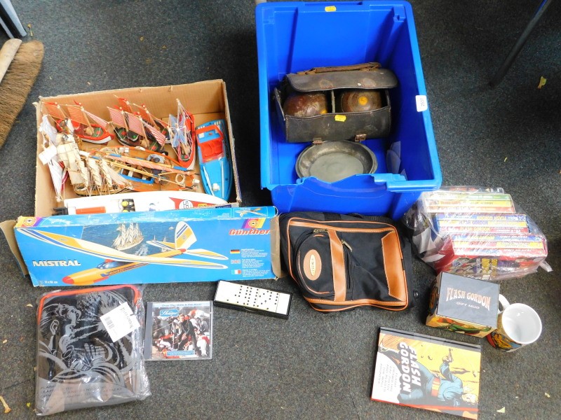 Games to include puzzles, chess sets, etc., wooden boat, Flash Gordon DVDs, etc. (5 boxes)