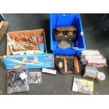 Games to include puzzles, chess sets, etc., wooden boat, Flash Gordon DVDs, etc. (5 boxes)