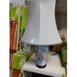A Chinese porcelain table lamp with a green shade, 49.5cm high.