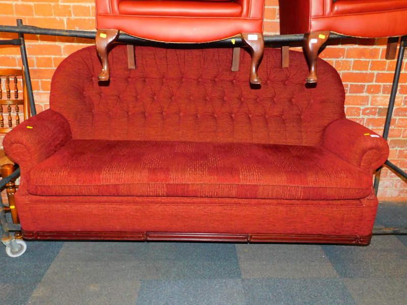 A three seater button back sofa, upholstered in red chenille fabric, 192cm wide.