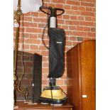 A Karcher floor buffer.