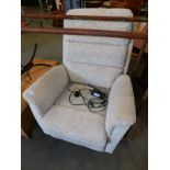 A Care Co electric rise and recline armchair, upholstered in a fawn leaf patterned chenille