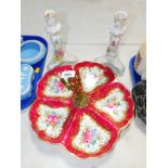 A Porcelain De France hors d'oeuvres dish, with central brass handle, decorated with flowers on a