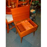 A mid 20thC teak sewing box, with internal pin tray, 50cm high, 50cm wide, 38cm deep.