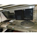 A JVC fully automatic turntable system L-L1, together with a Panasonic hi-fi system SG3200, with