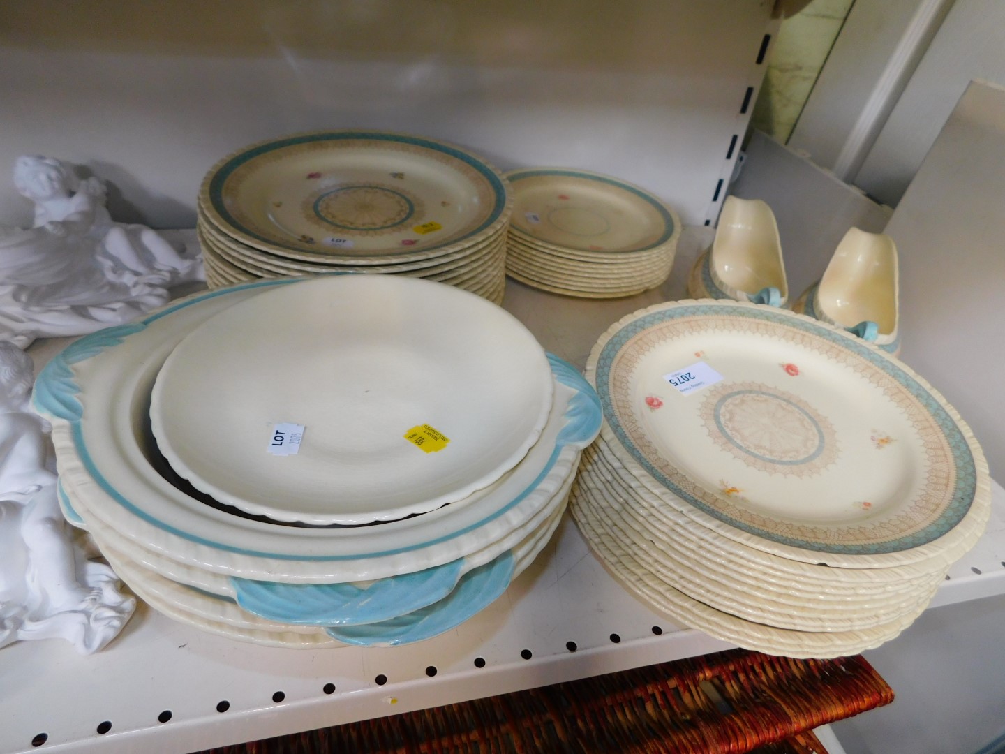 A Newhall pottery dinner service, decorated with floral sprigs, pattern 1264, comprising four