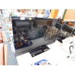 A Toshiba 32" LCD colour TV, model number 32DL933, with remote.