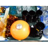 A French orange plastic ice bucket, six amber coloured glass coffee cups and saucers, and eight