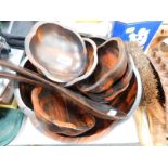 A treen salad bowl, servers and individual bowls, leather ammunition belts, cast iron kitchen scales