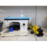 A Singer electric sewing machine, model 3105, together with a Karcher electric window cleaner, WV50.
