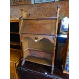 An early 20thC oak students bureau, with galleried back, fitted interior and two undershelves, 112cm