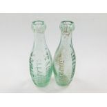 Two green glass lemonade bottles by Lee & Green Ltd, one marked for Bourne, the other for Sleaford
