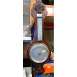 An oak aneroid barometer.