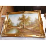 An oil on canvas river scene, signed Mitchell, in gilt frame.