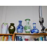 Five large vases, and a wrought iron and glass decanter. (6)