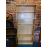 A beech effect bookcase, with five adjustable shelves, 181cm high, 78cm wide, 20cm deep.