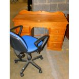 A modern pine kneehole desk, with lift lid, flanked by three drawers, 87cm high, 119cm wide, 51cm