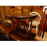 A reproduction hardwood drop leaf table, 92cm wide, 37cm deep, 93cm extended, together with a pair