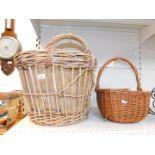 A wicker log basket, wicker shopping basket, and assorted linen. (quantity)