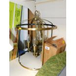 A brass four branch lantern type chandelier, 32cm diameter.