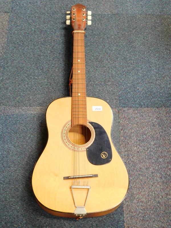 A Kay acoustic guitar.