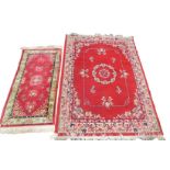 An Agadir red ground rug, 168cm x 120cm, together with a pink ground runner, 121cm x 61cm. (2)