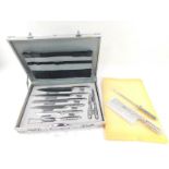 A Prot Messer stainless steel knife set, cased.
