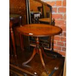 A reproduction mahogany tilt top occasional table, 49cm high, 54cm wide, 40cm deep.