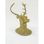 A Victorian brass novelty ink well cast as a deer's head, 10cm wide.