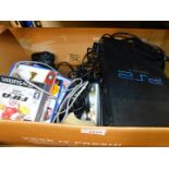 A Sony Playstation 2, together with assorted games, CD's and DVD's, soft toys etc. (1 box)