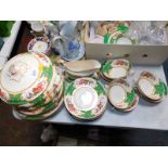 A Sampson Bridgewater & Son pottery part dinner service, decorated with reserves of fruit and