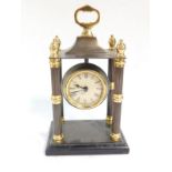 An Indian steel and brass Portico clock, 26cm high.