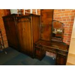 A stained oak Butilux Gothic style four piece bedroom suite, comprising gentleman's wardrobe,