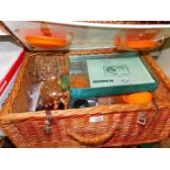 A picnic hamper containing picnic wares, glass ware, Nytech digital camera, DN-4020 and sundries.