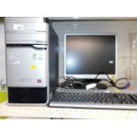 An Acer Aspire personal computer E500-997T, with a Suyama monitor.