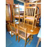 A stained oak extending refectory dining table, 75cm high, 166cm wide, 214cm extended, 88cm deep,