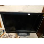 A Sony Bravia 32" colour LCD television, model number KDL-32V2000, with remote.