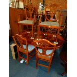 A yew wood pedestal dining table, 75cm high, 117cm wide, 154cm extended, 118cm deep, together with