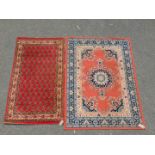 A pink ground wool rug, 168cm x 121cm, together with a Bidtar Tekke style red ground rug, 156cm x