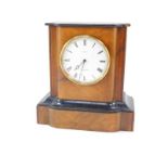 A French walnut and ebonised mantel clock, circular enamel dial, marked for Pearce, Grantham.,