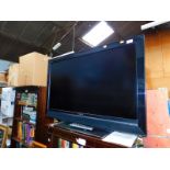 A Sony 40" LCD colour television, model KDL40V3000, with remote and instructions.