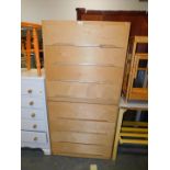 A pair of birch ply wood chests of four drawers, 76cm wide, 37cm deep, 76cm high.