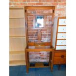 A stained oak hall stand with four hooks, central mirror and glove box, 182cm high, 77cm wide,