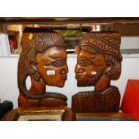 A pair of African tribal head carvings, 46cm high.