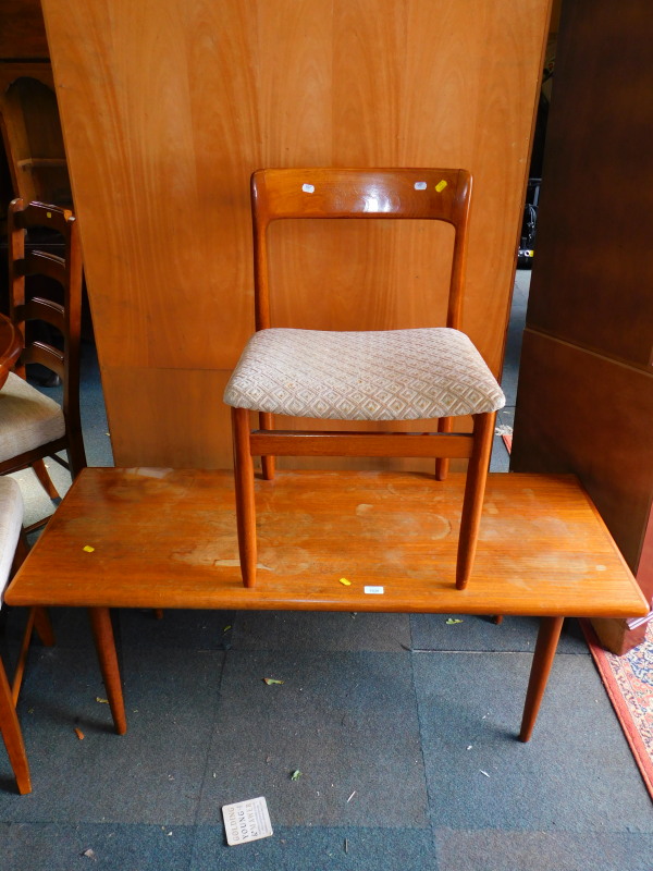 A mid 20thC teak coffee table, 48cm high, 132cm wide, 52cm deep, together with a teak dining