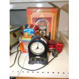 A Funrise plastic rock 'n roll jukebox, Avalon Quartz alarm clock radio, Steepletone jukebox, RR02.,