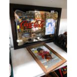 A Coca Cola advertising mirror, 29cm high, 42cm wide and a Paddington mirror 23cm high, 14cm