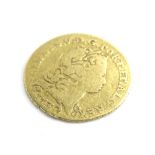 A George III gold quarter guinea, dated 1762, worn.